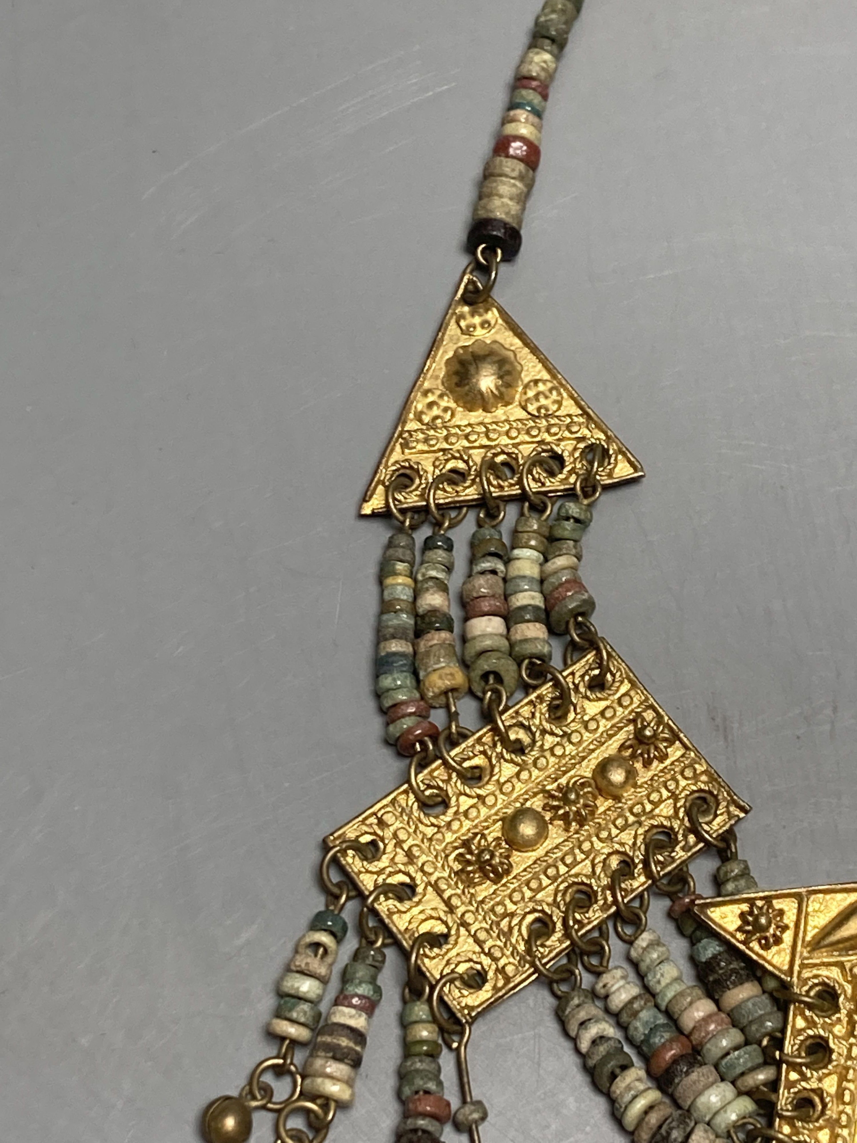 An antique Mayan? gilt metal and hardstone set drop necklace, 42cm.